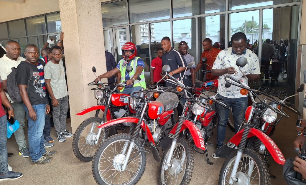 Ssome DAOs with their assigned bikes at the turning-over ceremony at the Ministry of Agricukture HQ