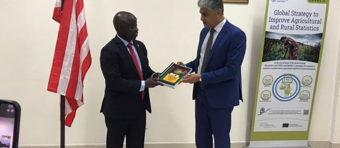 Agriculture Minister Dr. J. Alexander Nuetah  handing a copy of the NADP over to RICOWAS's delegation's head, Mr. Nabil Ben Kharta