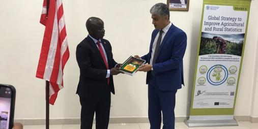 Agriculture Minister Dr. J. Alexander Nuetah  handing a copy of the NADP over to RICOWAS's delegation's head, Mr. Nabil Ben Kharta
