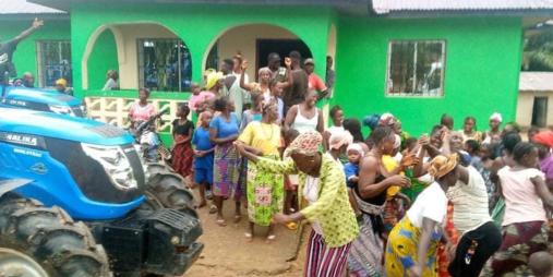 Farmers in Foya celebrate the arrival of a tractor  